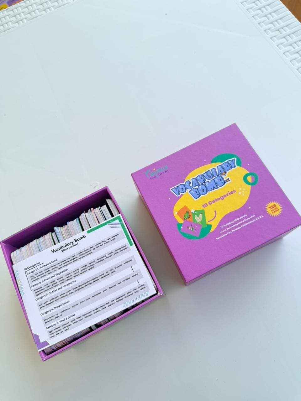 The Vocabulary Bomb box open, with the "what's inside" category card